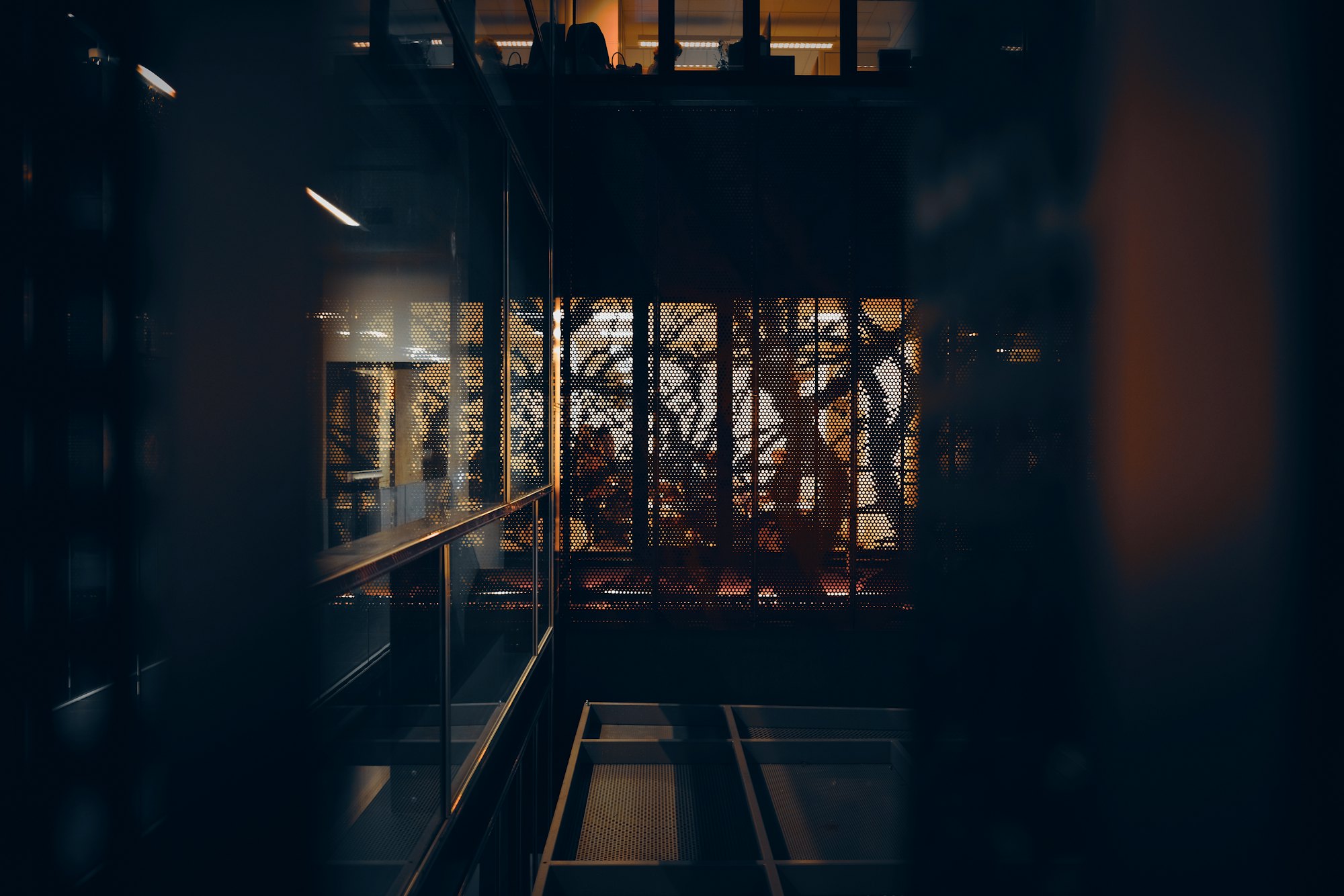 Empty corporate stairwell in dramatic light, representing Noble Attorneys' workplace sexual harassment practice in California
