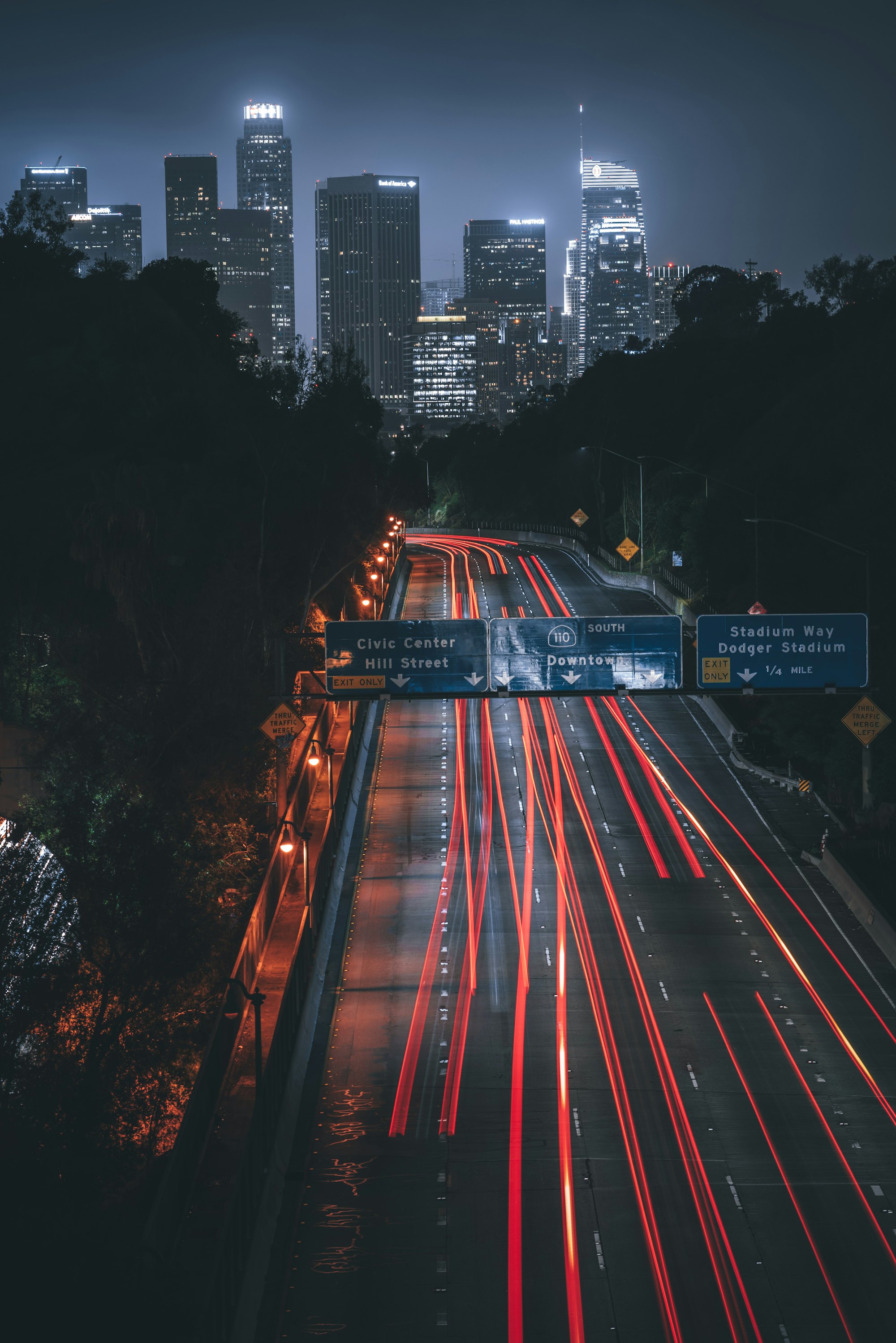 Los Angeles freeway at night with light trails from passing vehicles, representing Noble Attorneys' rideshare accident practice